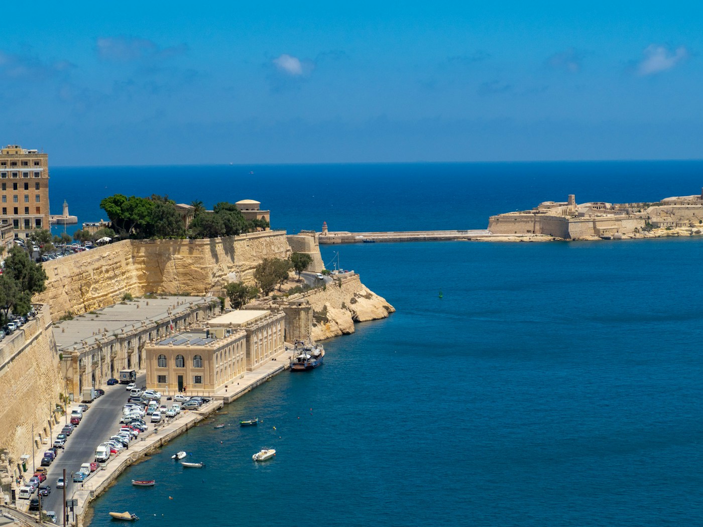 Malta's sunlit limestone architecture beside the Mediterranean Sea